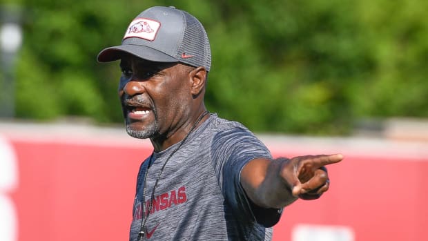 Razorbacks secondary coach Marcus Woodson on the outdoor practice fields Wednesday morning